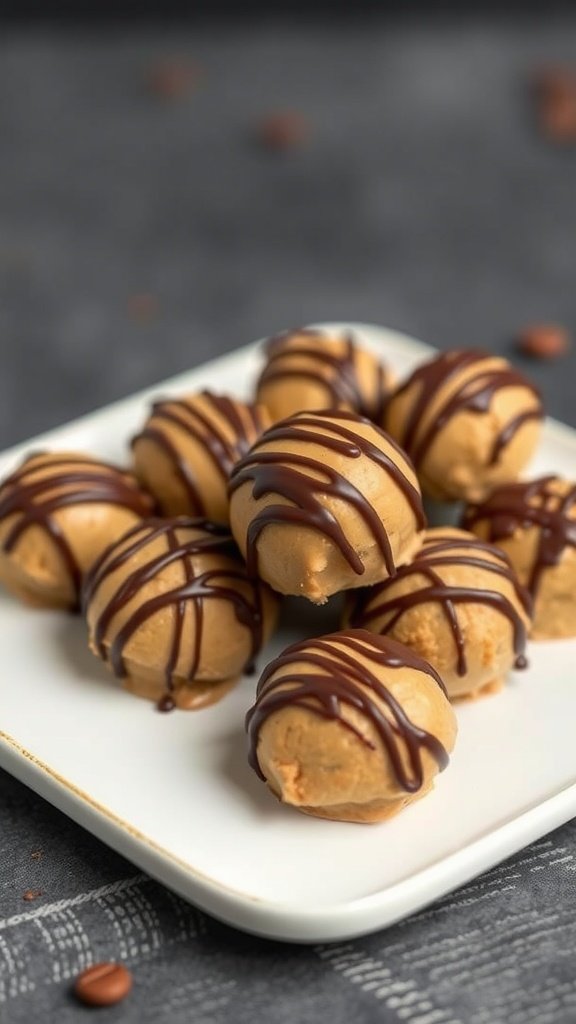 A plate of peanut butter fat bombs drizzled with chocolate.